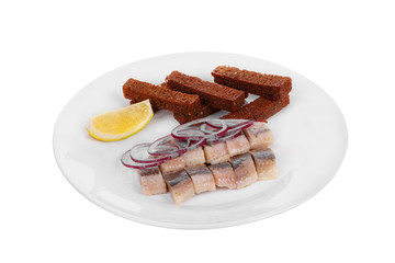 Snack, croutons from black, rye, bread, herring, fish lightly salted, onion rings, lemon slice, aperitif before alcohol on plate, white isolated background Side view. For the menu, restaurant, cafe