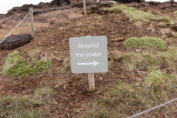 Shield with directional arrow and the inscription - Around the crater