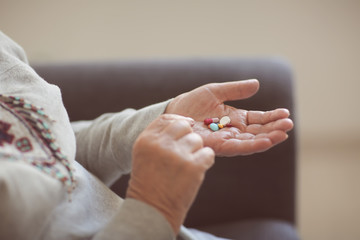 Senior woman with pills, closeup