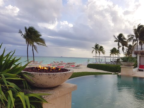 Fire Pit Next To A Infinity Pool In The Beach In The Island Of Nassau, Bahamas