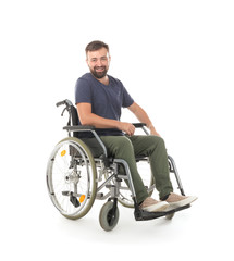 Happy man in wheelchair on white background