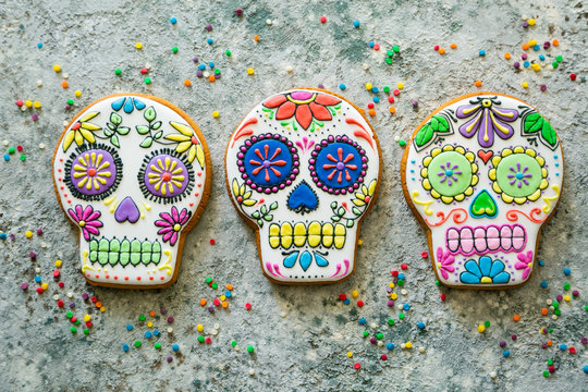 Dia de los muertos concept - skull shaped cookies with colorful decorations, top view