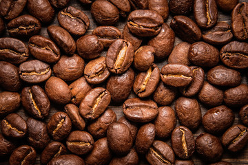 coffee beans on wooden background and empty space