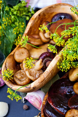Aromatic spices for canning vegetables and mushrooms  on dark background.