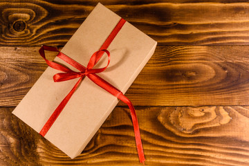 Cardboard gift box on a wooden table. Top view