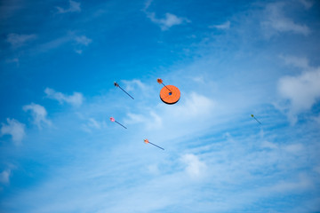Arrows flying at the target, on blue sky background