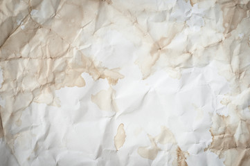 Background texture of crumpled aged paper with spot and stain