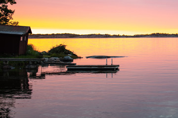 Fototapeta premium Looking past the swim float just before sunset on the Island of Aspö in Archipelago National Park (Skärgårdshavet nationalpark), Finland, 4 days after the summer solstice.