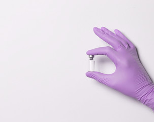 Doctor holding syringe and medicine for vaccination, closeup