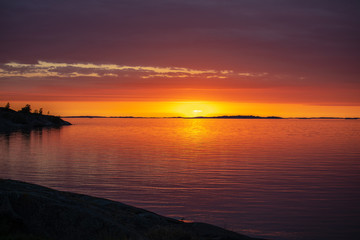 The setting sun on the Island of Aspö in Archipelago National Park (Skärgårdshavet nationalpark), Finland, 4 days after the summer solstice.