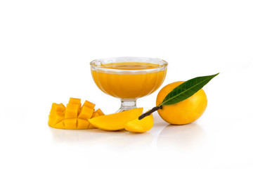 A single mango with Mango slices mango juice  and mango cubes isolated on a white background