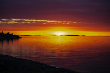 The setting sun on the Island of Aspö in Archipelago National Park (Skärgårdshavet nationalpark), Finland, 4 days after the summer solstice.