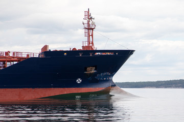 Tanker ship creates bow wave as it leaves Turku heading into the Baltic Sea, in Archipelago...