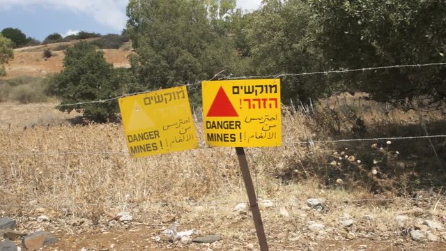 Danger Warning Sign Against Old Landmines In Golan Heights border in Israel