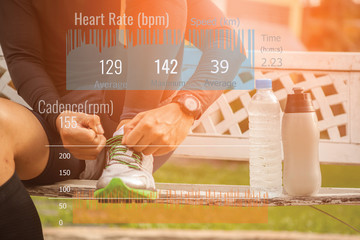 Exercising man checking notifications on health tracker