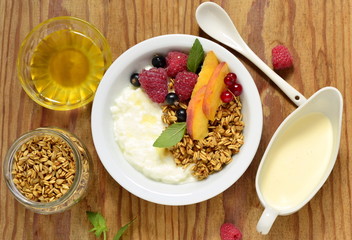 Healthy breakfast with yogurt, granola, fresh berries. Dietary nutrition, top view 