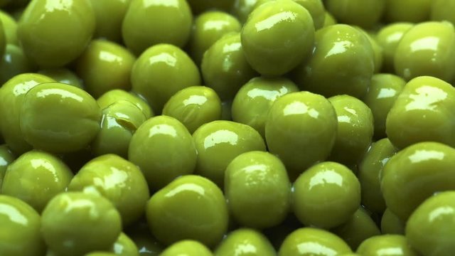 UHD macro of the green peas on rotating stand