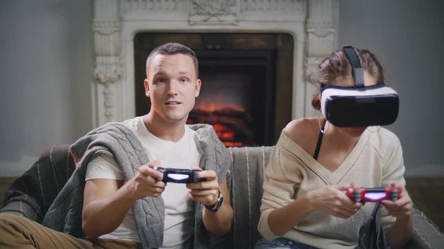 Two young people playing video games together
