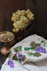 Grapes, Ripe bunches of grapes on vintage scales
