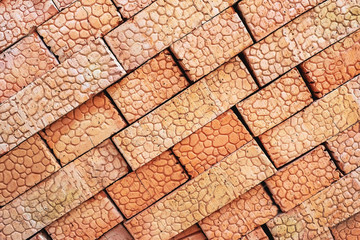 Brown bricks folded into a pile, a background from bricks.