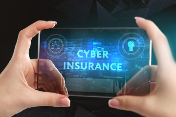 The concept of business, technology, the Internet and the network. A young entrepreneur working on a virtual screen of the future and sees the inscription: Cyber insurance