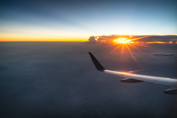 Plane travel sunset, gold sunshine