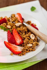Strawberry Cinnamon Granola Yogurt Breakfast. Selective focus.