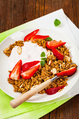 Strawberry Cinnamon Granola Yogurt Breakfast. Selective focus.