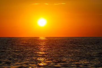 Fototapeta na wymiar Rays of sunset on the black sea