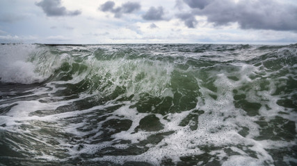 Storm waves on the seashore as a background