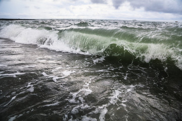 Storm waves on the seashore as a background