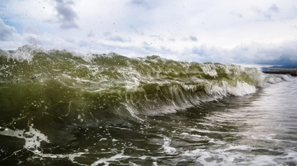 Storm waves on the seashore as a background