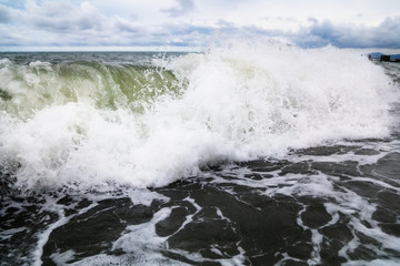 Fototapeta na wymiar Storm waves on the seashore as a background