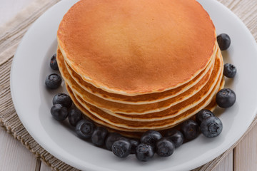 Dish of blueberries and pancakes