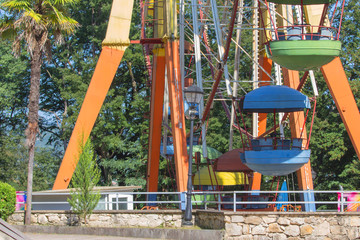 fragment A colourful ferris wheel. Ferris wheel on a bright sunny day