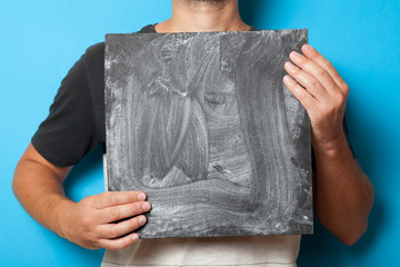 Hands holding chalkboard mockup. Advertisement background. Art frame blank. Creative canvas.