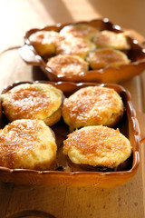 baked champignon mushrooms on a wooden background