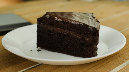 Close up of delicious Chocolate cake dessert on wood table backgrounds