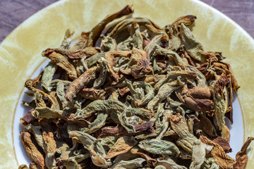 Cropped shoot of traditionally dried under sun string beans on plate