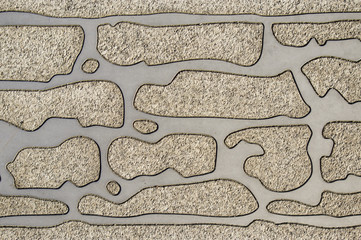 Granitsteine in Edelstahlplatte eingefasst als Stadtmöbel als Hintergrund, Granite stones in stainless steel plate edged as street furniture as background - obrazy, fototapety, plakaty