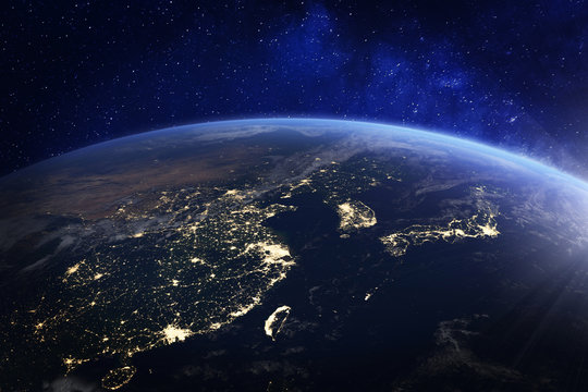 Fototapeta Asia at night from space with city lights showing human activity in China, Japan, South Korea, Hong Kong, Taiwan and other countries, 3d rendering of planet Earth, elements from NASA