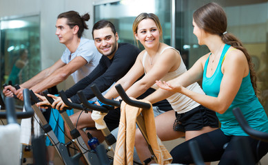 People training on exercise bikes