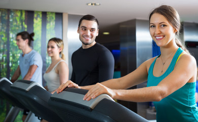 Fototapeta na wymiar People training on treadmills