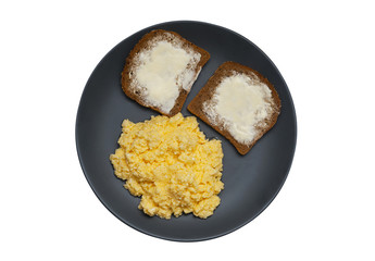 Scrambled eggs with dark bread isolated on white background