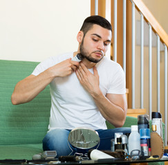 Guy shaving by trimmer