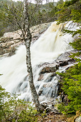 Water crashing over the rock faces, South East Brook Falls, Gros Morne National Park, Newfoundland,...