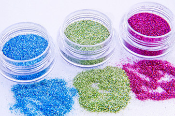 Multi-colored Sequins for the design of nails in a box. Glitter in jars. Foil for nail service....