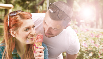 young couple with ice cream. reflected light effect
