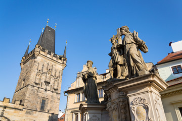 Obraz premium Statue of Holy Savior with Saints Cosmas and Damian detail on Charles Bridge, Prague, Czech Republic