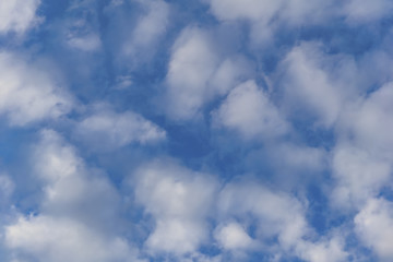 background - blue day sky with white cirro-cumulus clouds
